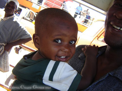 Little boy with father on Likoni-Ferry from Mombasa Town to Likoni South Coast